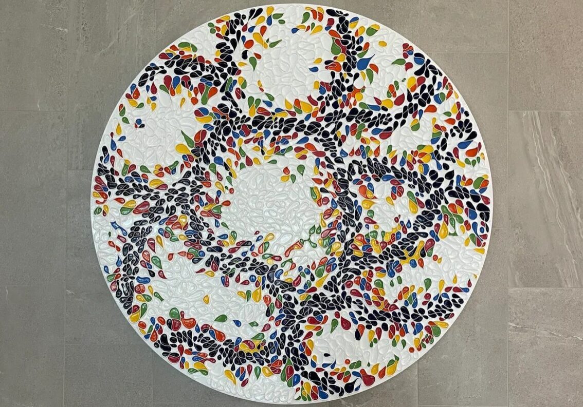 A white plate with many colored sprinkles on it
